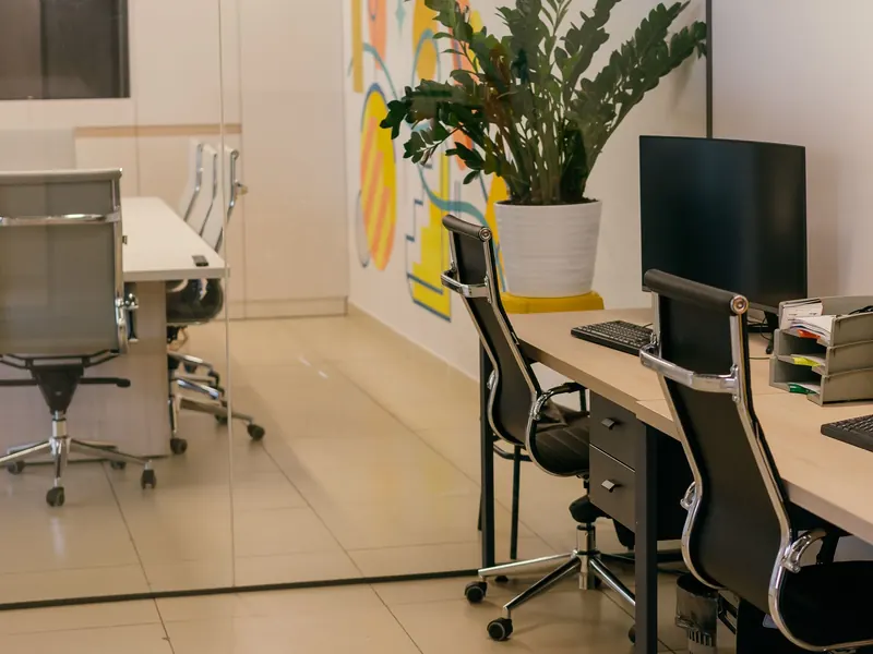 Tidy open-plan office with desks and chairs